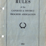 Front cover of the original 1952 Rules of Capertee and District Progress Association. The Cover is grey with a single black line border. It has the words “Capertee and district Progress Association” and underneath that is symbol which is shaped like a cut profile of a car tyre and below that is “1952”.